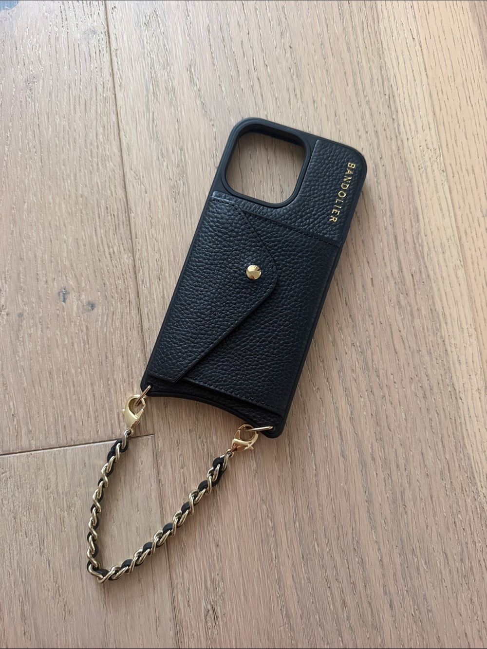 Bandolier Black Pebble Leather Phone Case with Gold Chain Strap iPhone 15 promax